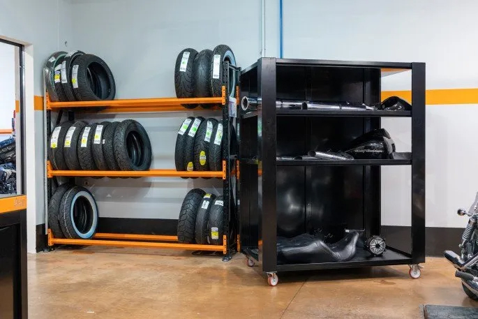 Motorcycle wheel alignment tool in use in a workshop